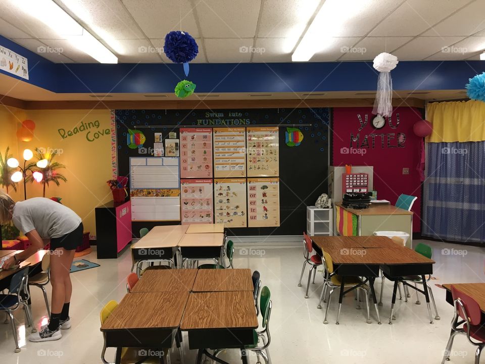 Teacher preparing a classroom 