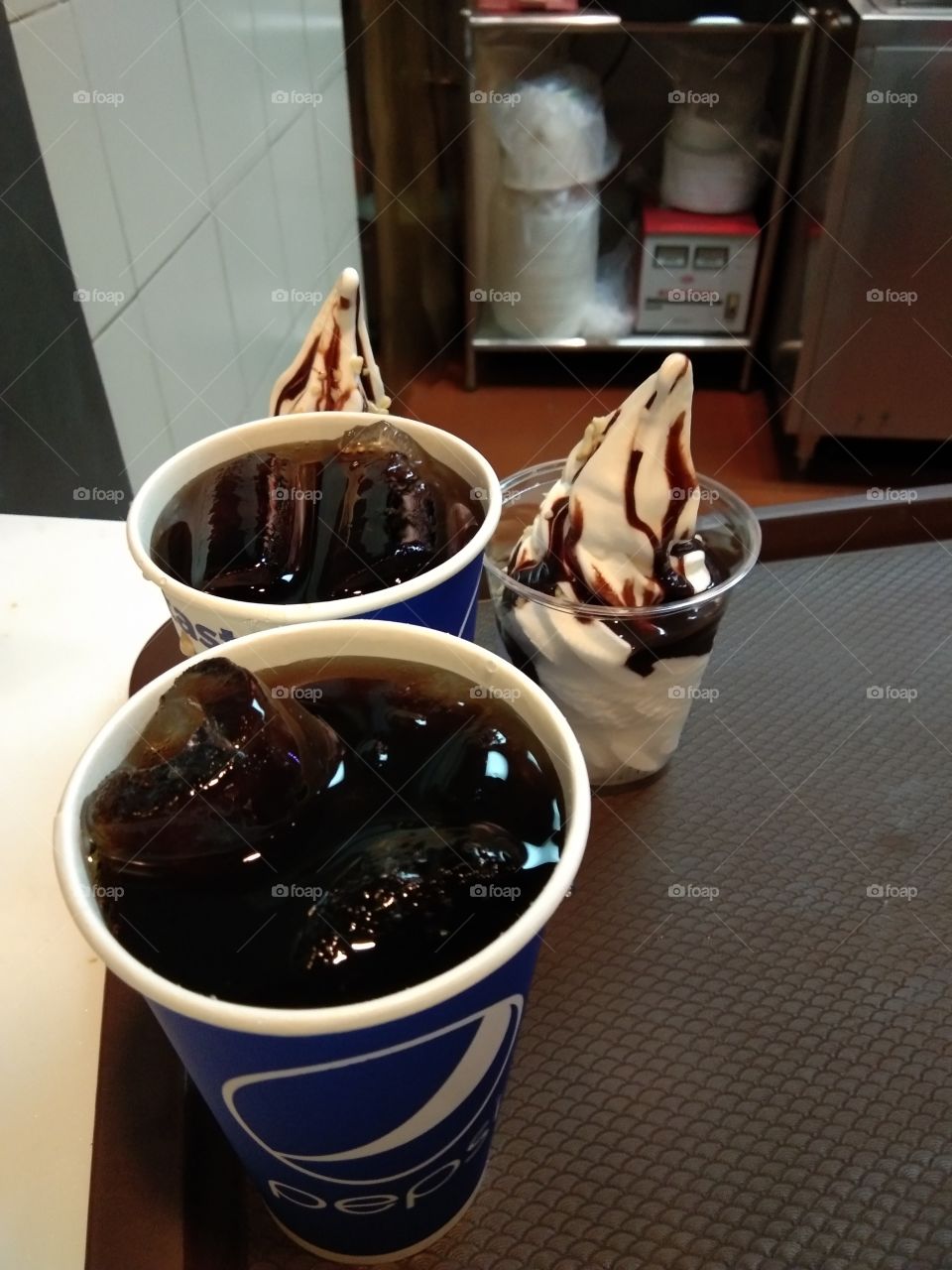 black soda drink with ice cream