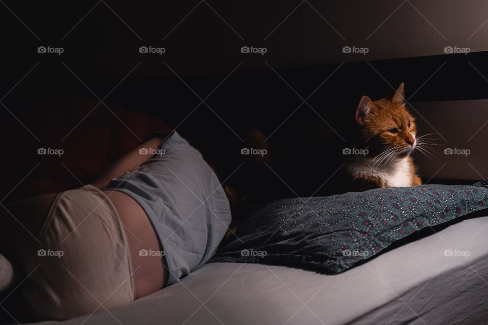 Girl  sleep with a cat.