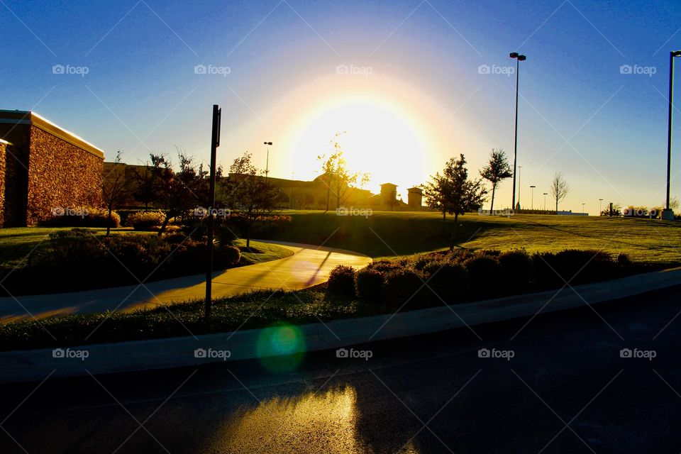Sunset with night lights and camera bokeh 