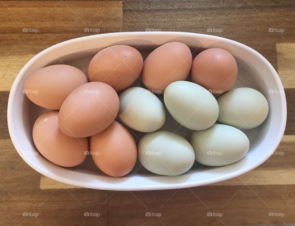 Blue and brown fresh eggs
