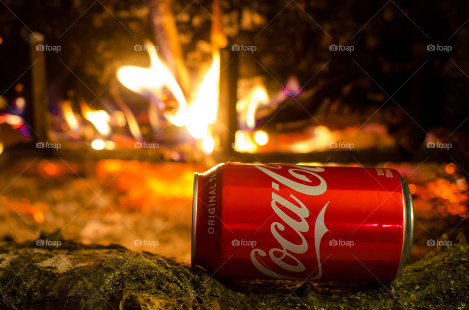 Enjoy a nice Coca-Cola in front of a warm fire