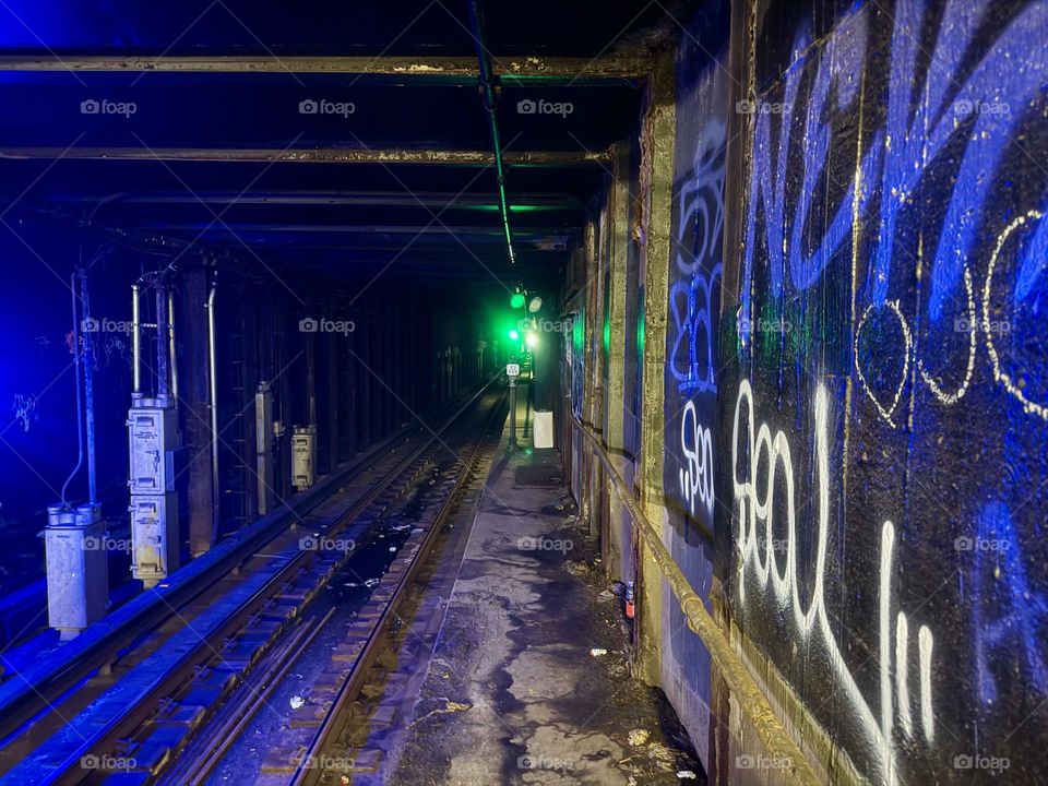 This is the graffiti covered tunnel of the MTA “G” train “Clinton - Washington” station in “Clinton Hill”, Brooklyn illuminated by a green light. 2024. Hypnotic Productions