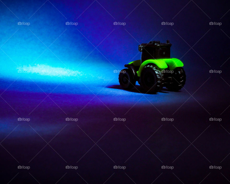 Agricultural machinery Tractor black and green on a dark background