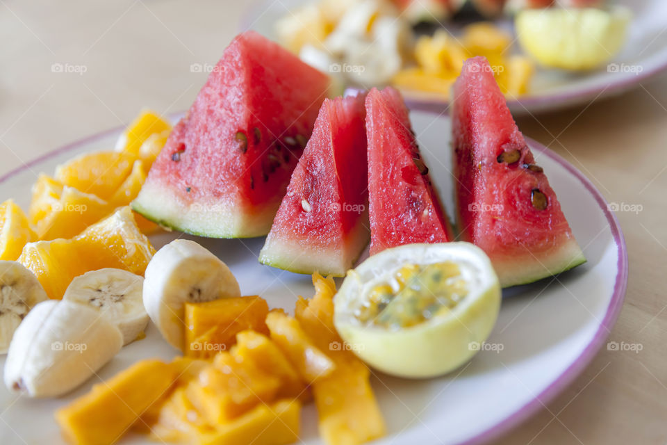 Juicy fruits on a plate ready to be eaten