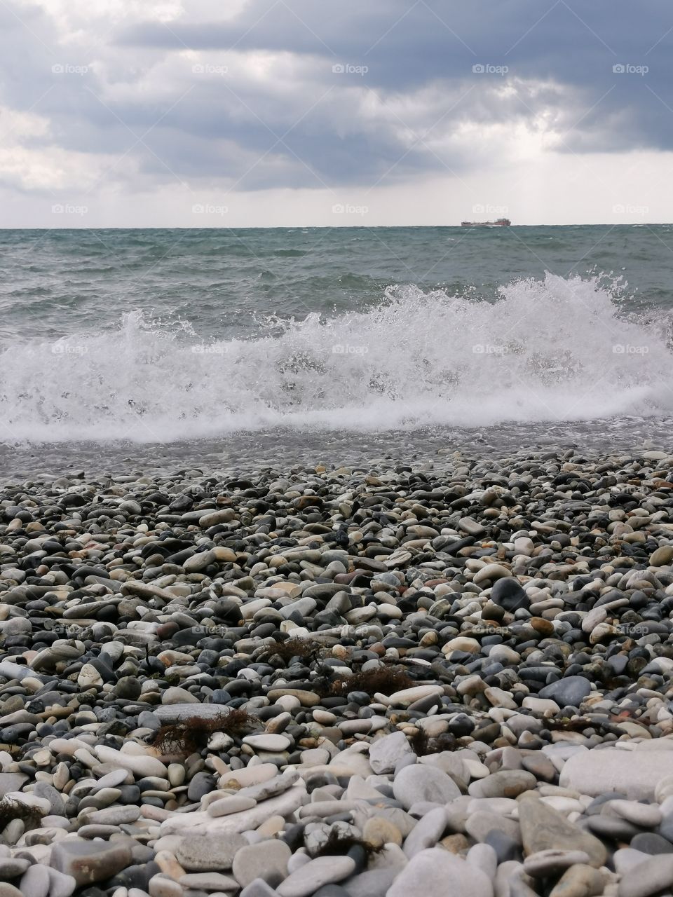 I sit on the rocks and admire the sea