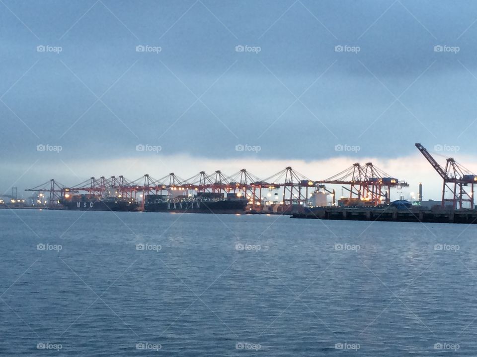 Port of Long Beach cargo ship and cranes 