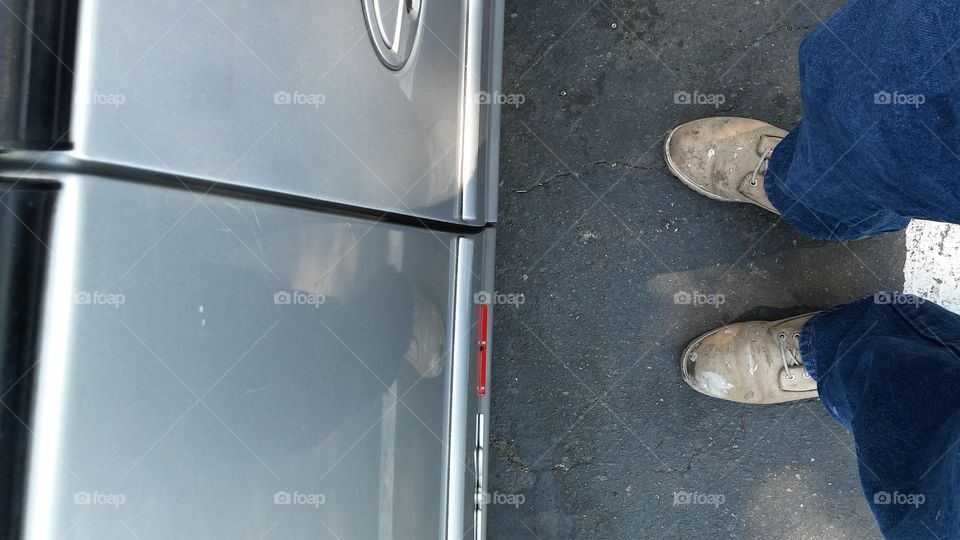 me standing at my car at work