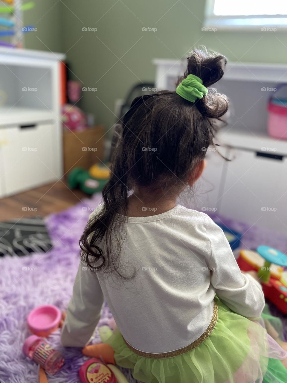 Little girl has crazy hair, crazy hairdo on toddler, toddler has crazy hair, toddler dressed up for Saint Patrick’s Day, celebrating Saint Patrick’s Day 