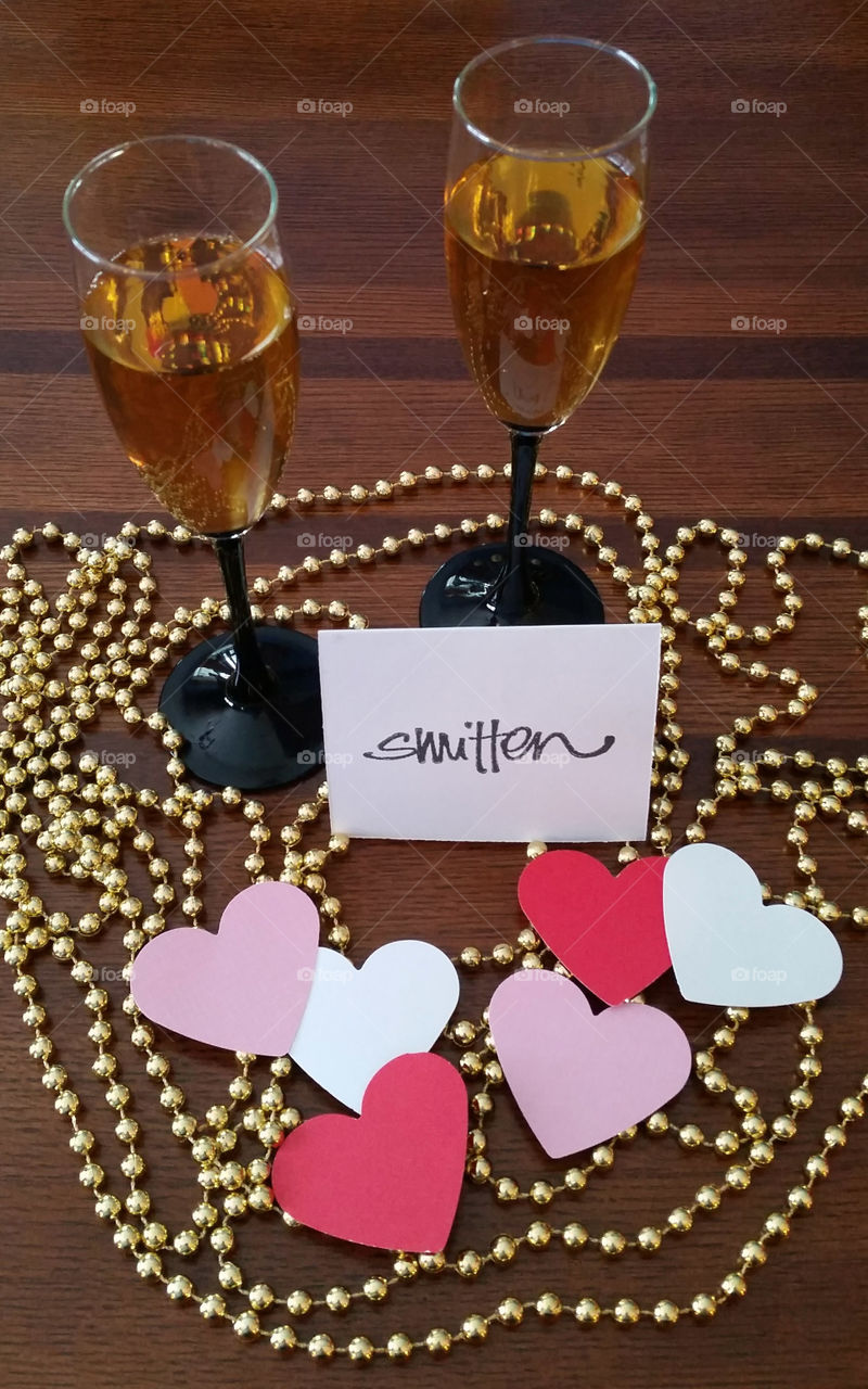 Wine glasses with gold beads and hearts