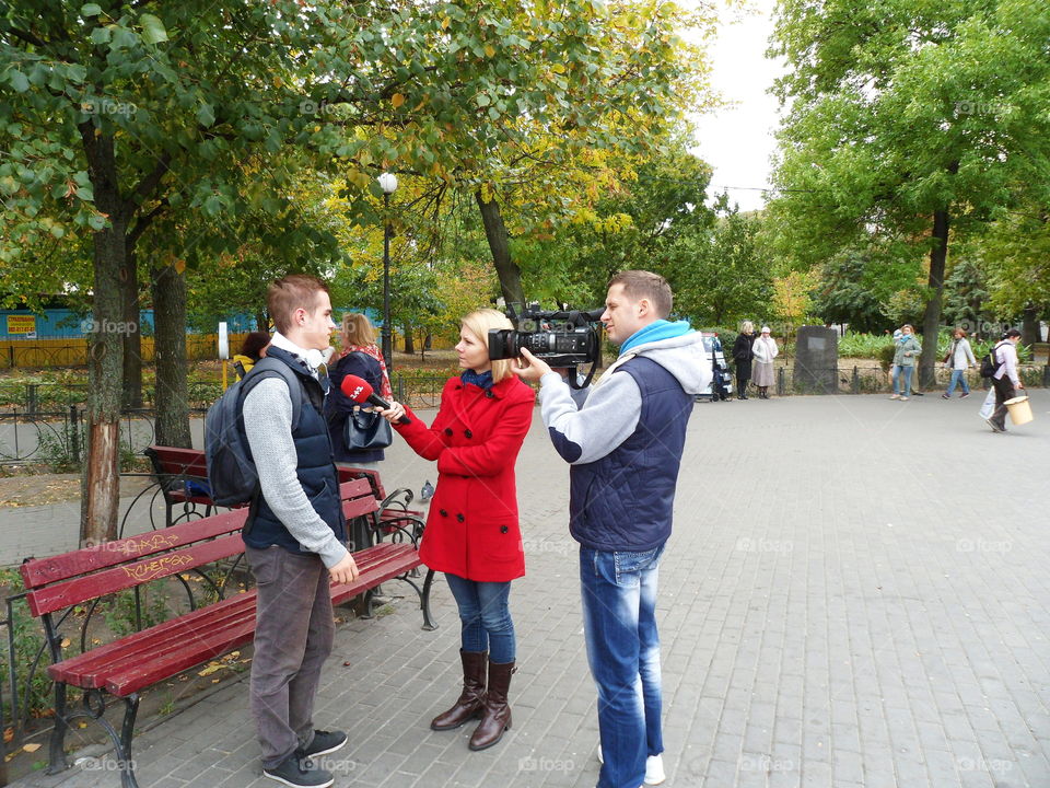 journalists interviewed in the street  man