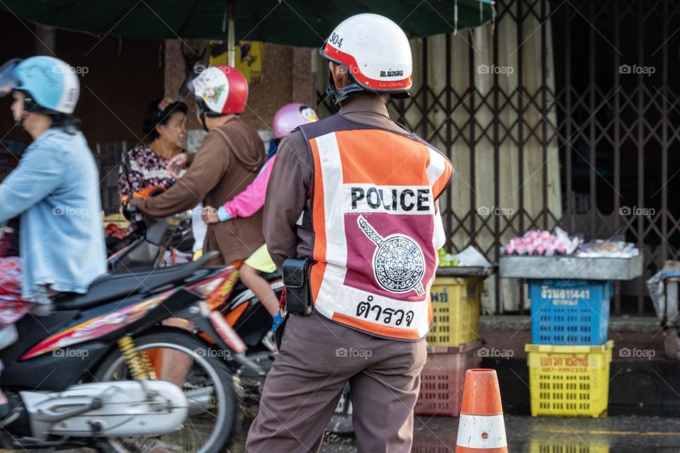 Thailand police on his work