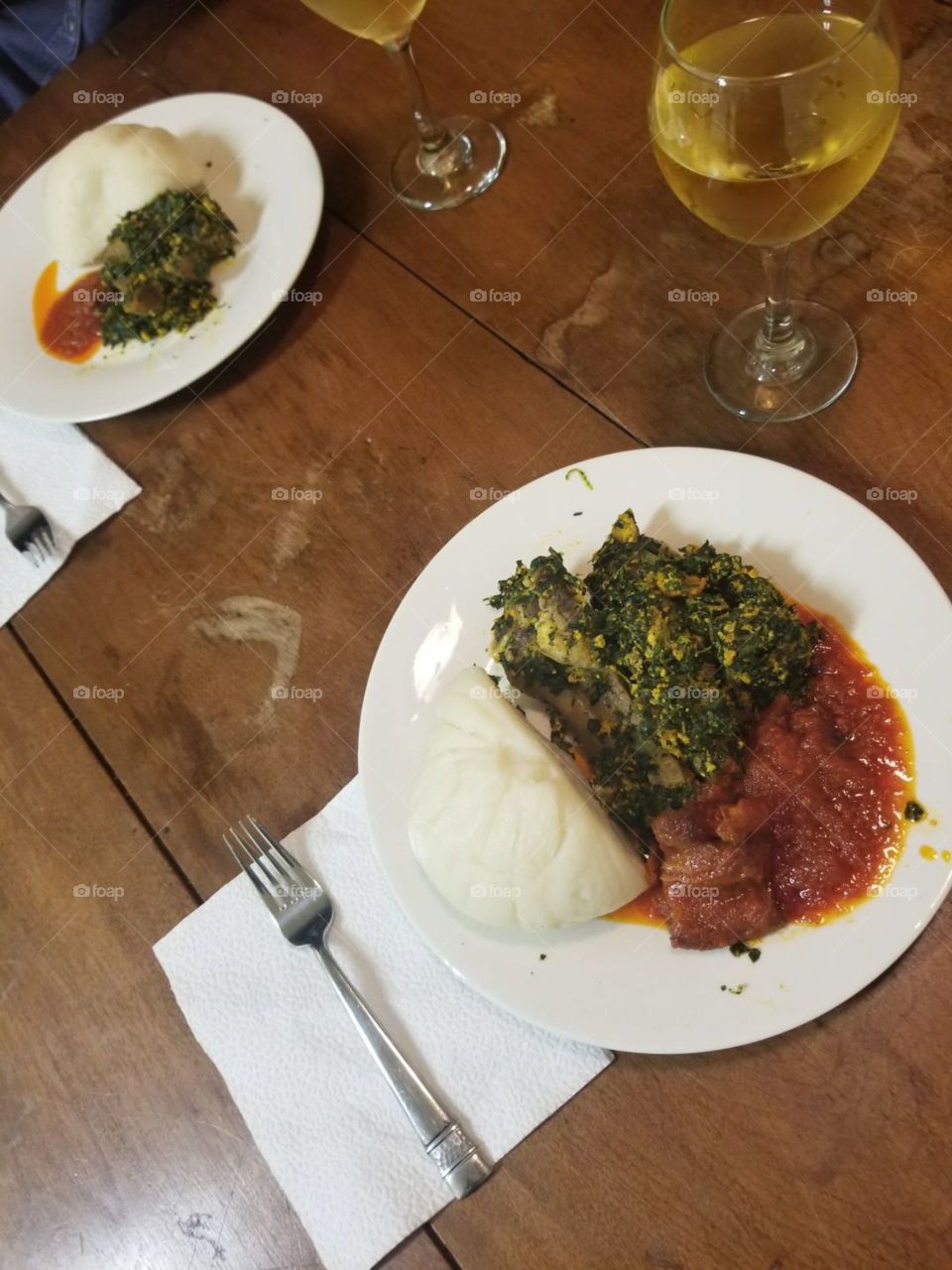 African nigerian food, egusi soup, pounded yam, and stew
