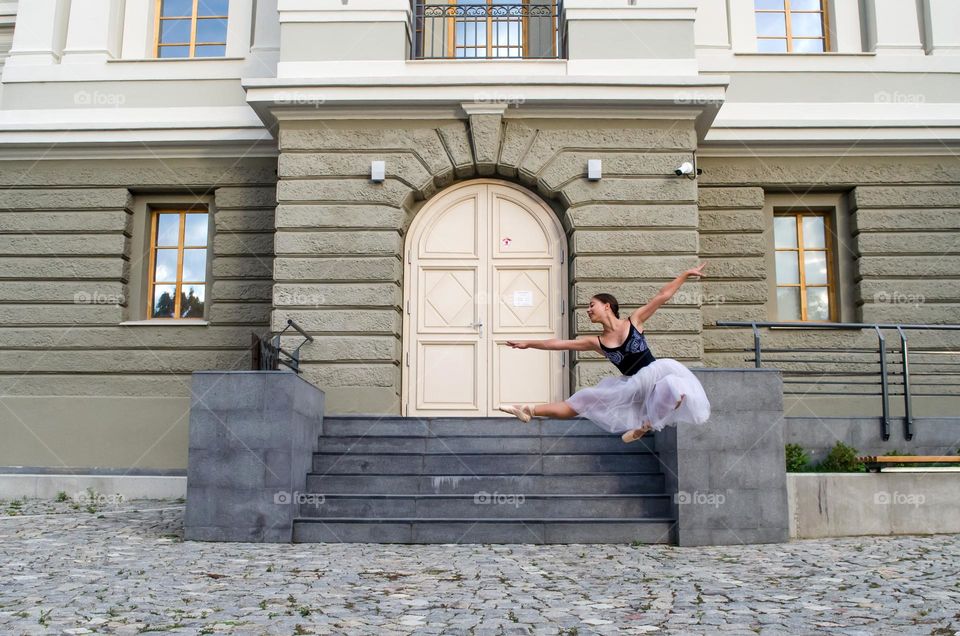 Young Female Ballerina Dancing Outside