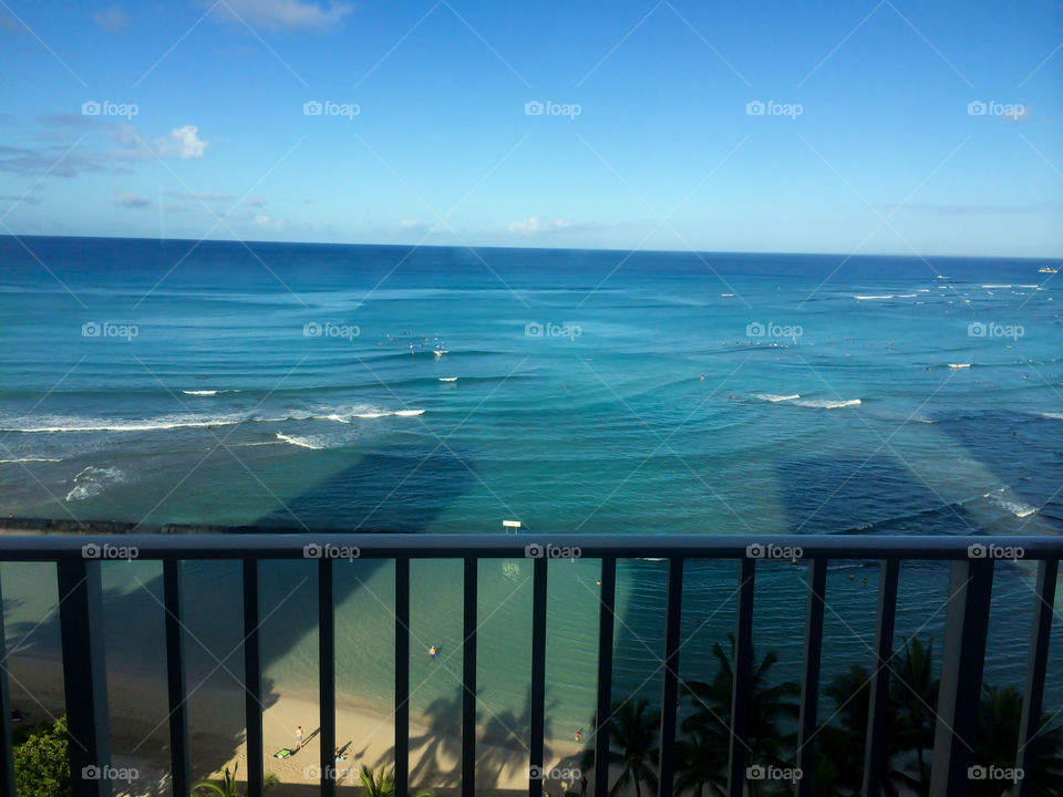 Buildings of Waikiki shadow on the ocean elevated view 