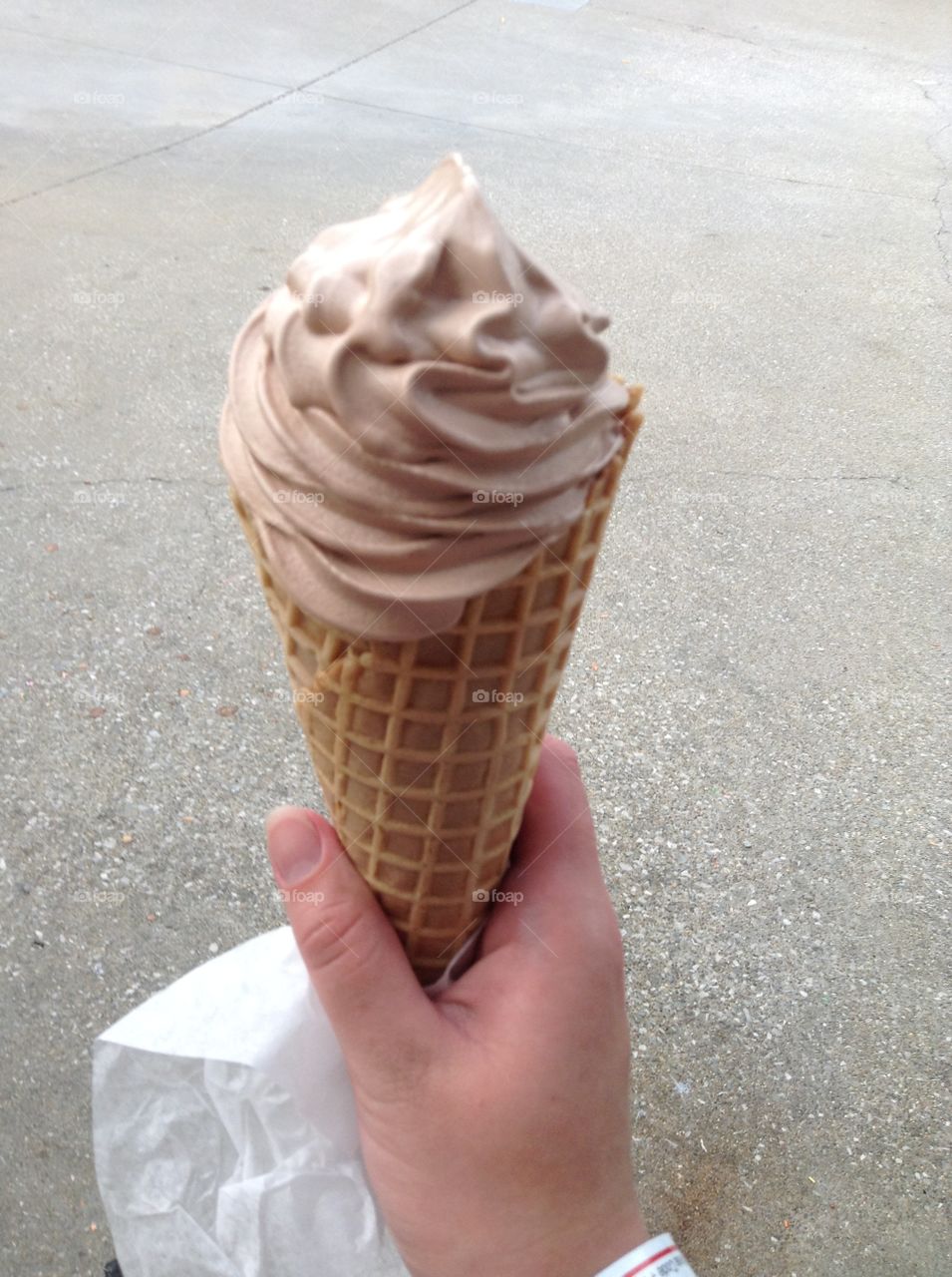Hands holding ice cream 