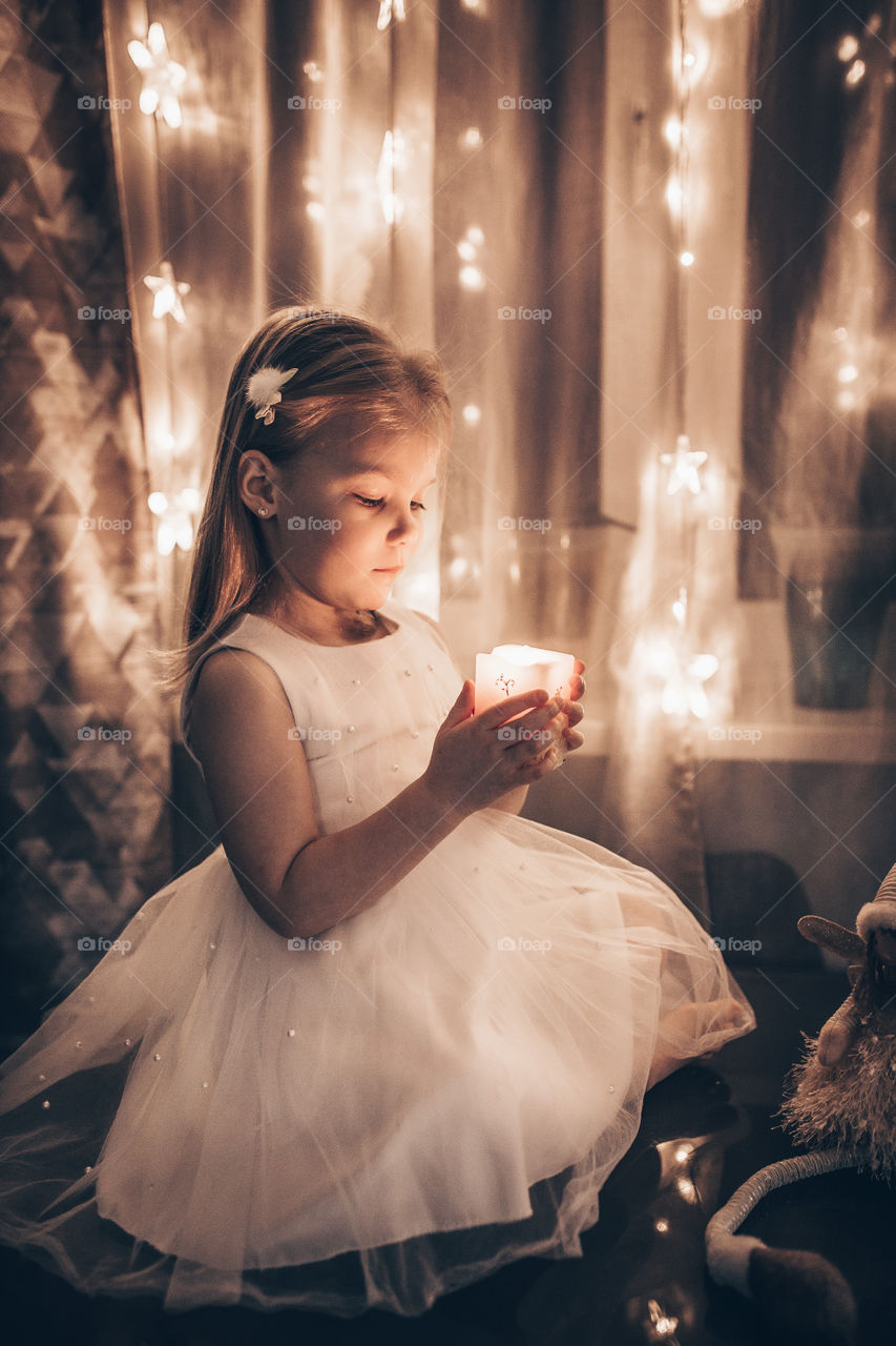 girl and christmas lights