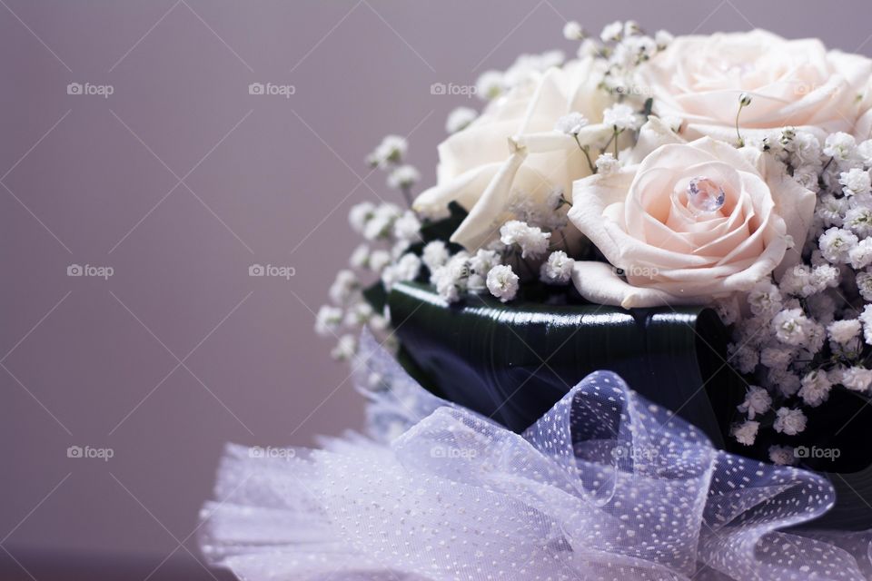 beautiful wedding bouquet. white roses in wedding bouquet