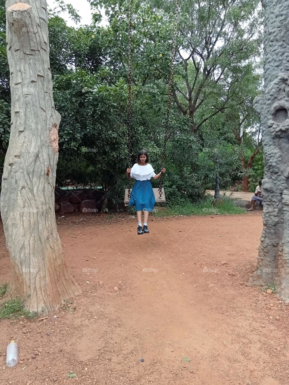 Swing in garden, playing for children. Very nice and beautiful garden. So many flowers, plants, artificial animals, bird's and toys for children.