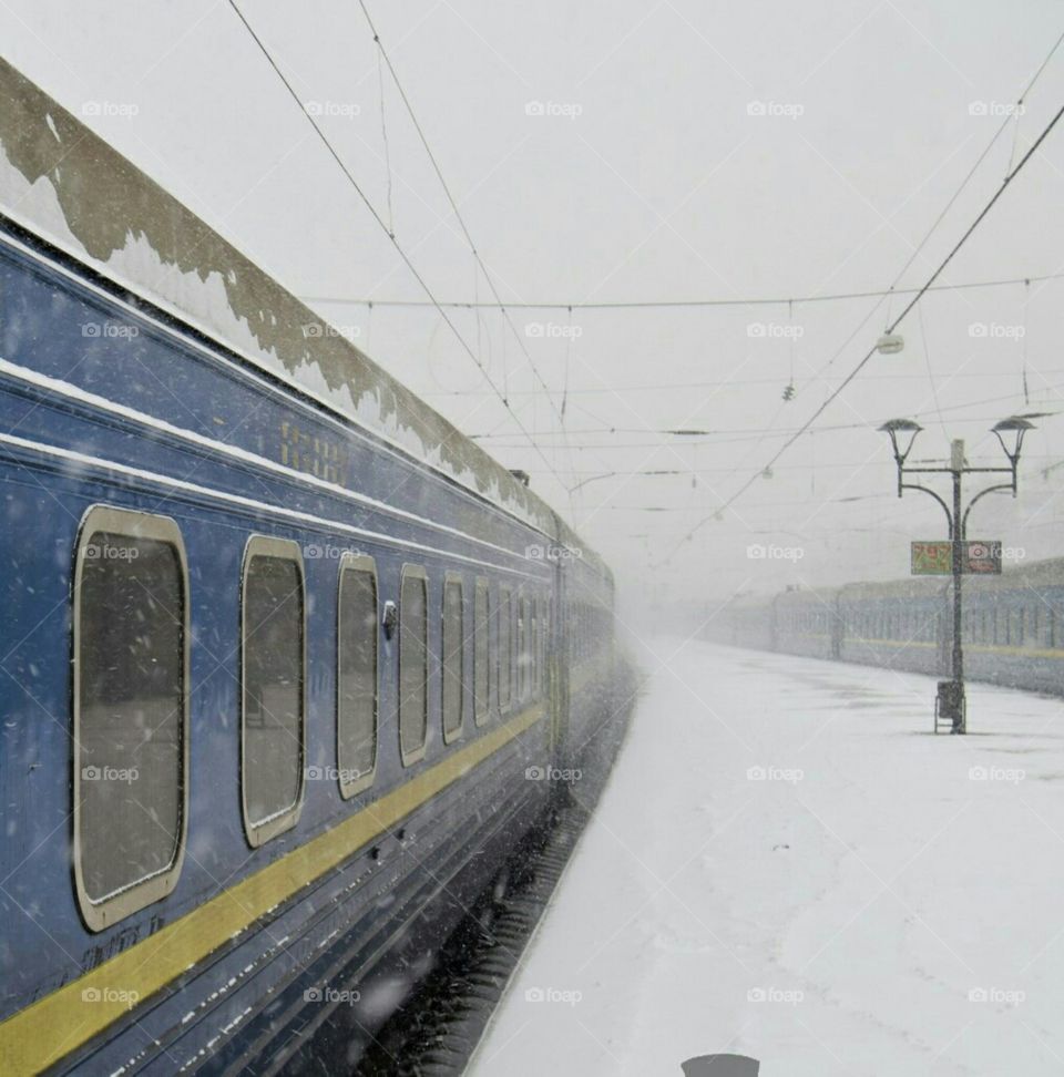 Train at snowy railway platform