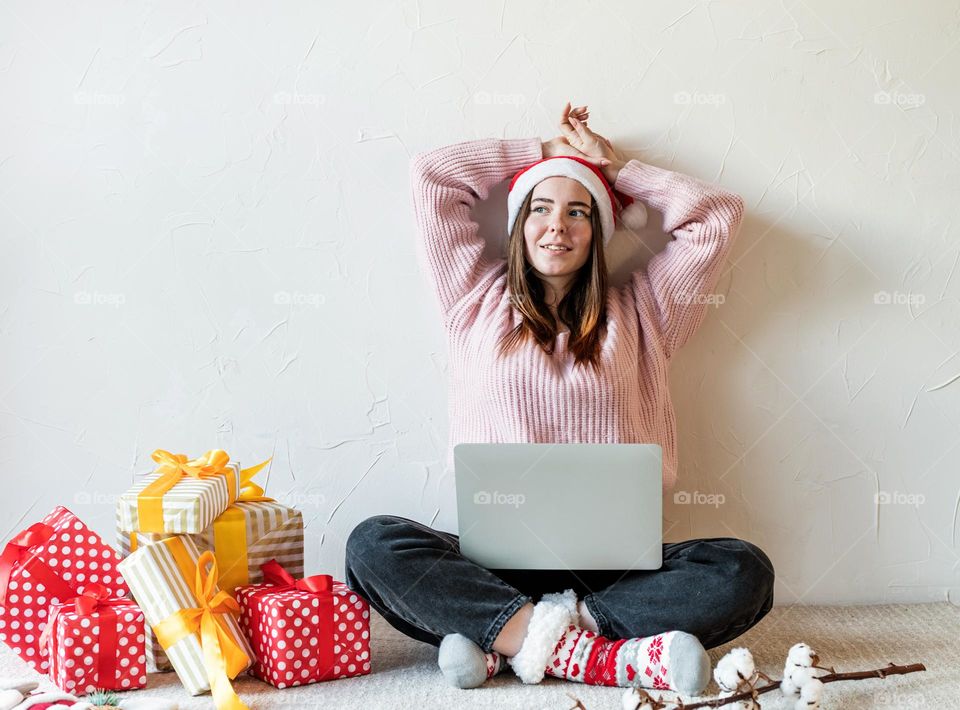 woman holding christmas gifts