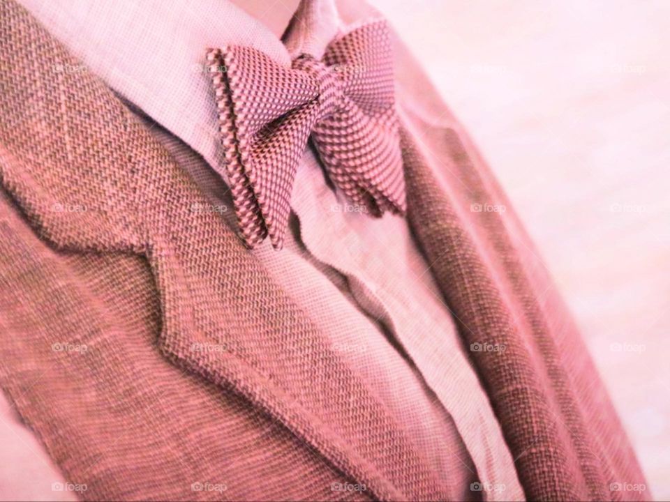 Man in a pink jacket with a bow tie