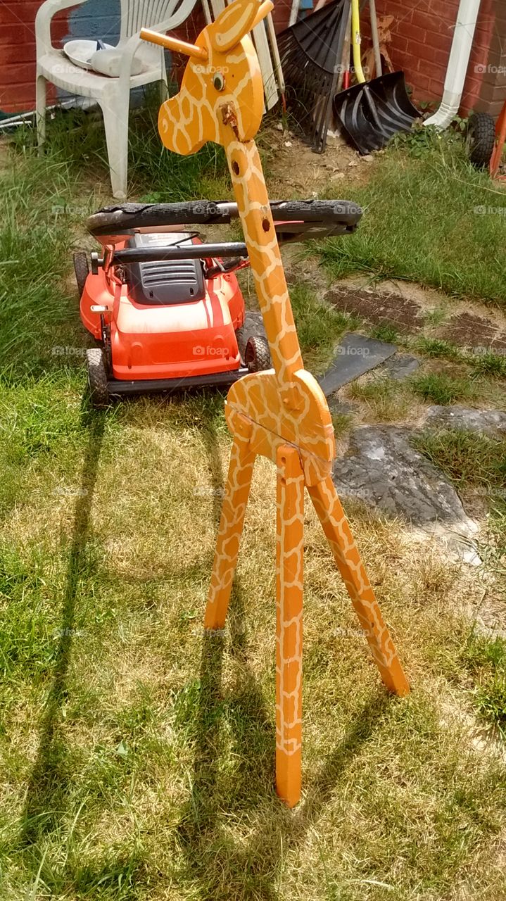 Daddy Giraffe Mowing the Lawn