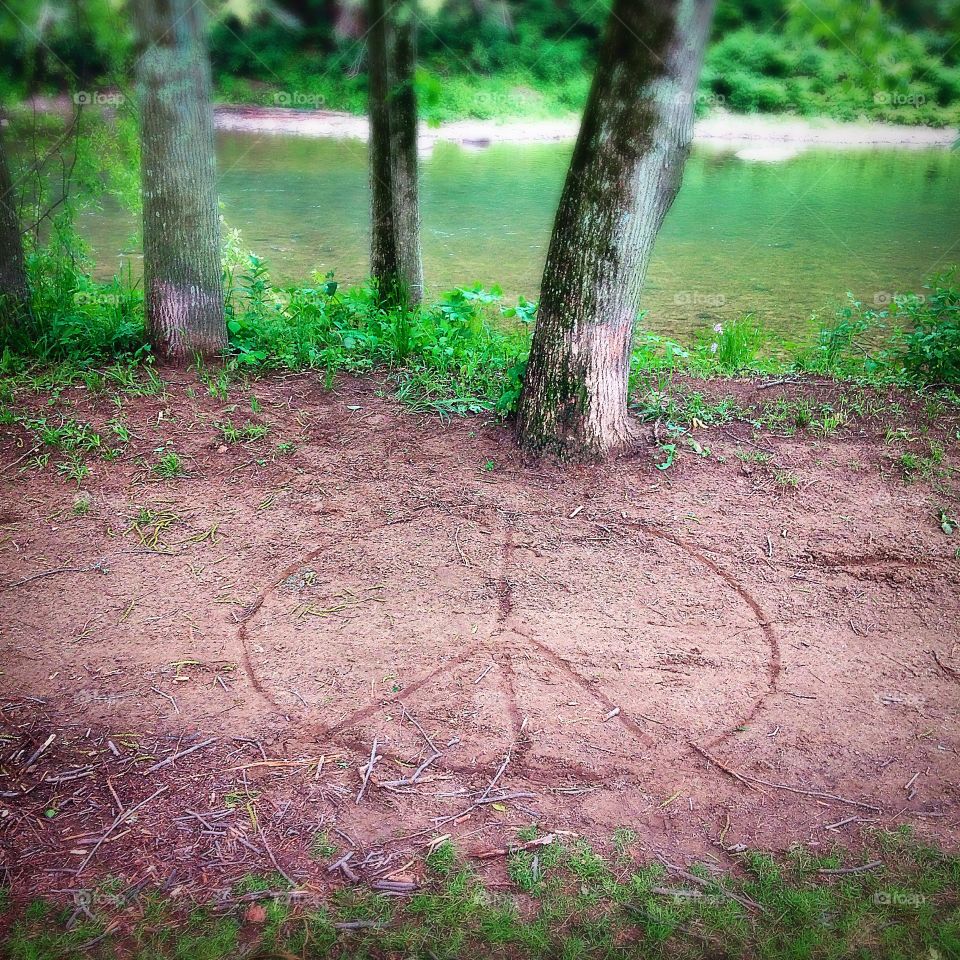 Bike path in park with peace sign. 
