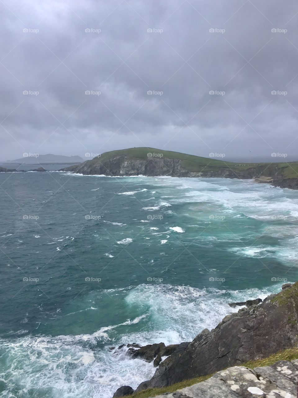 Rocky shore and foamy sea