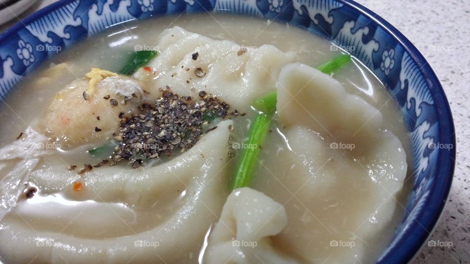 Chinese dumping soup. Chinese dumping soup with spring onion and coarse pepper.