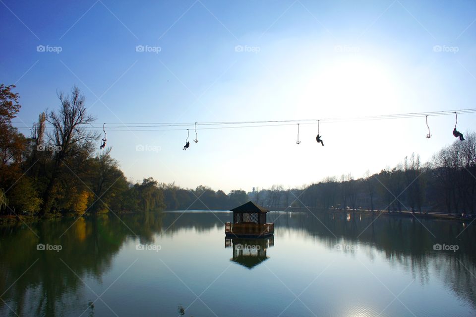 Floating gazebo and cable way above the lake in Nalchik Park.