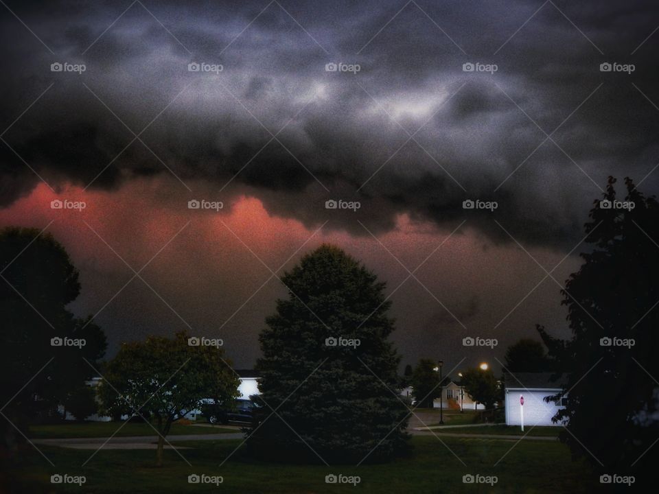 mysterious storm cloud brings pink lightning