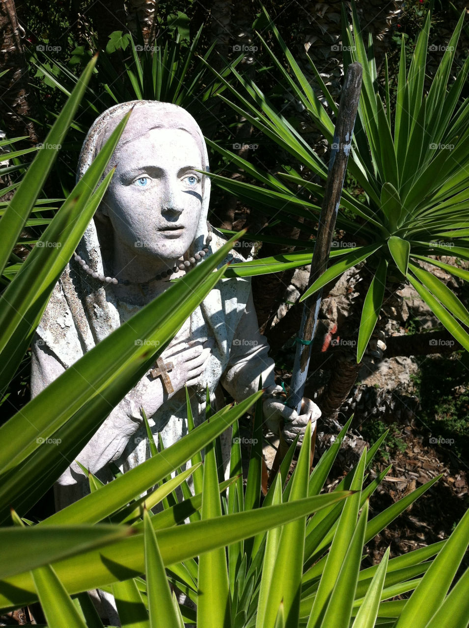 statue catholic mysterious missionary by monolith