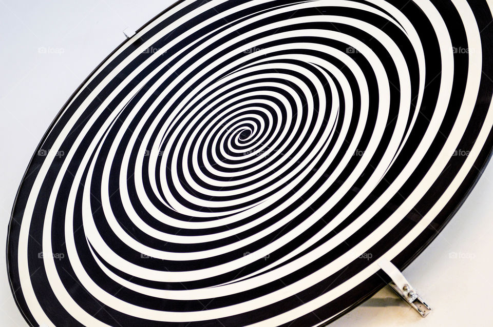 Black and white hypnotic spiral circle