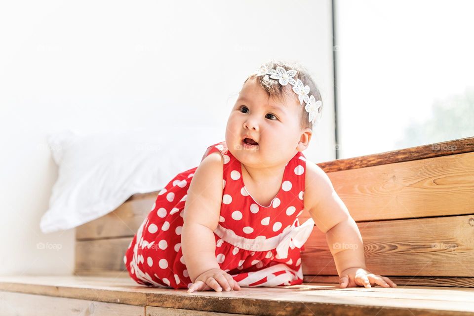 cute little baby in red polka dot dress