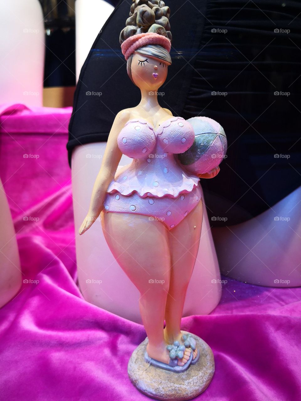 Figurine of a lady going to the beach.