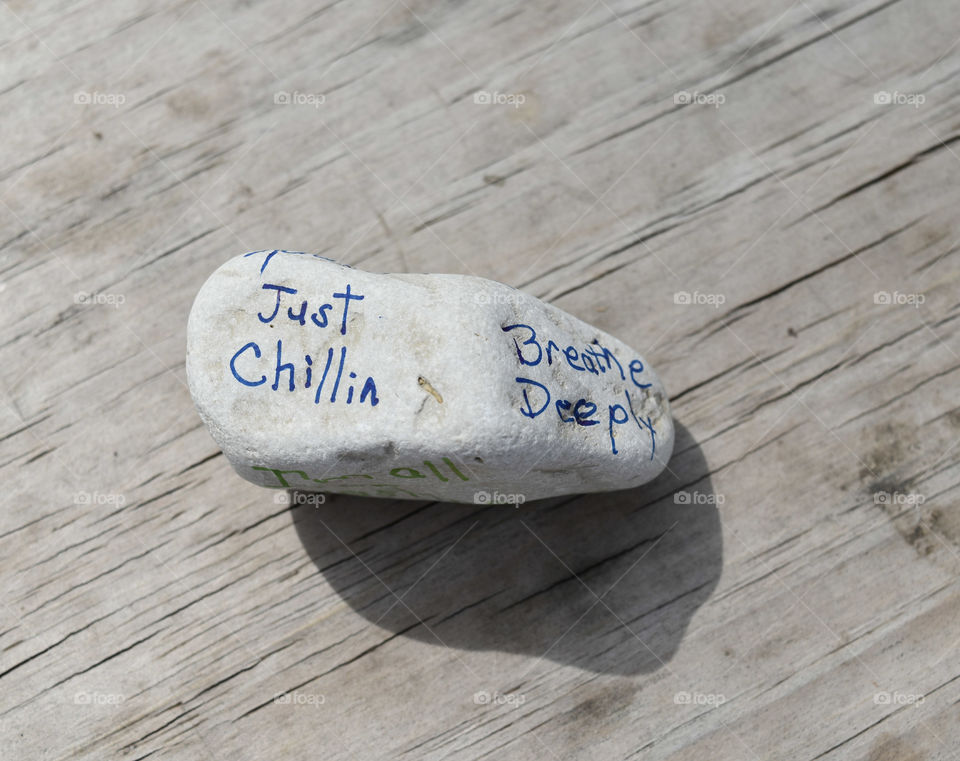 Stone with an affirmation written on it