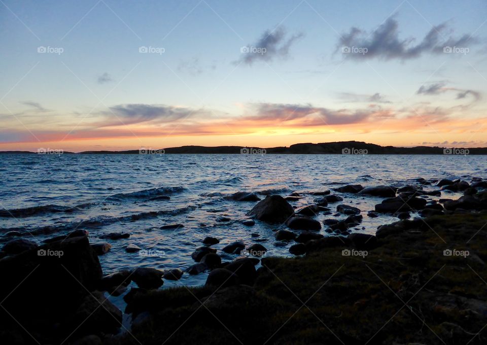 Black rocks in sunset