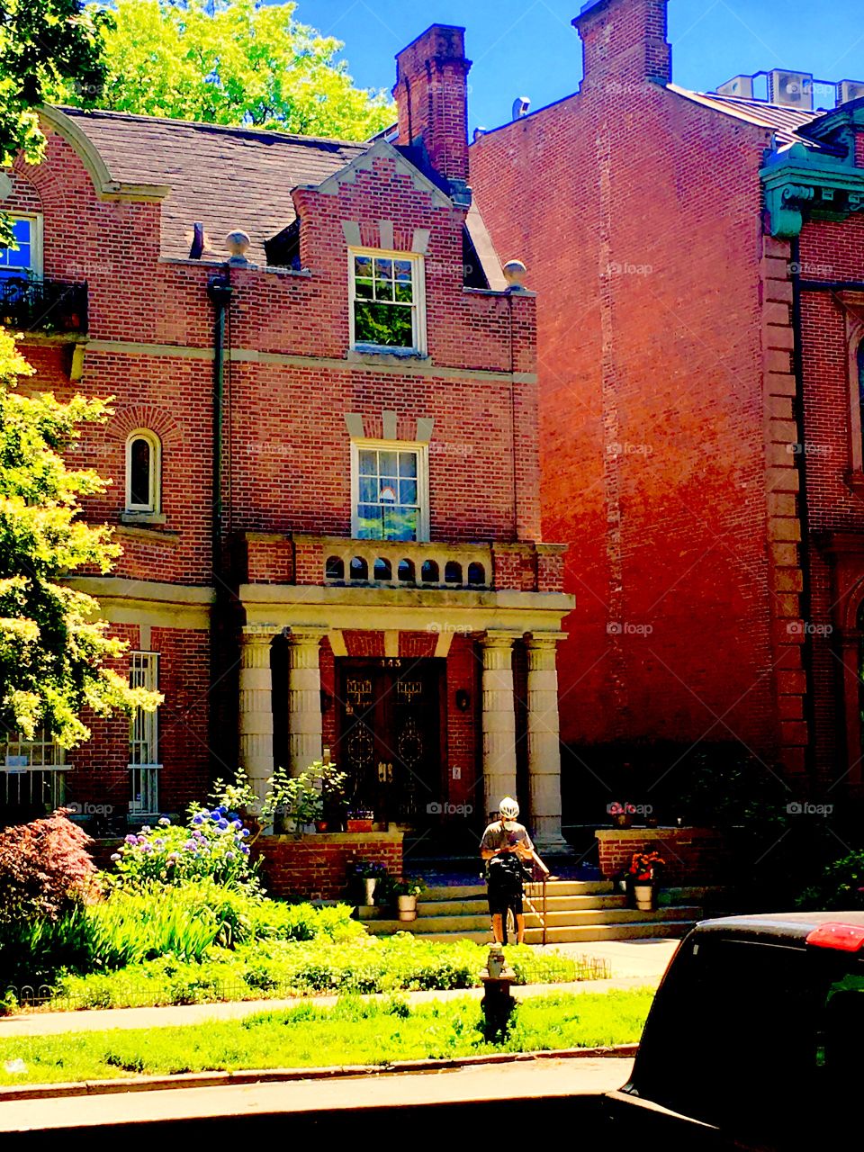 A Fort Greene, Bklyn brownstone w unusual architectural detail and nostalgic elements: Columns to the left and right of the entrance, the stepped shape of the roof of the offset part over the entrance, stucco ornaments … 2020. Hypnotic Productions