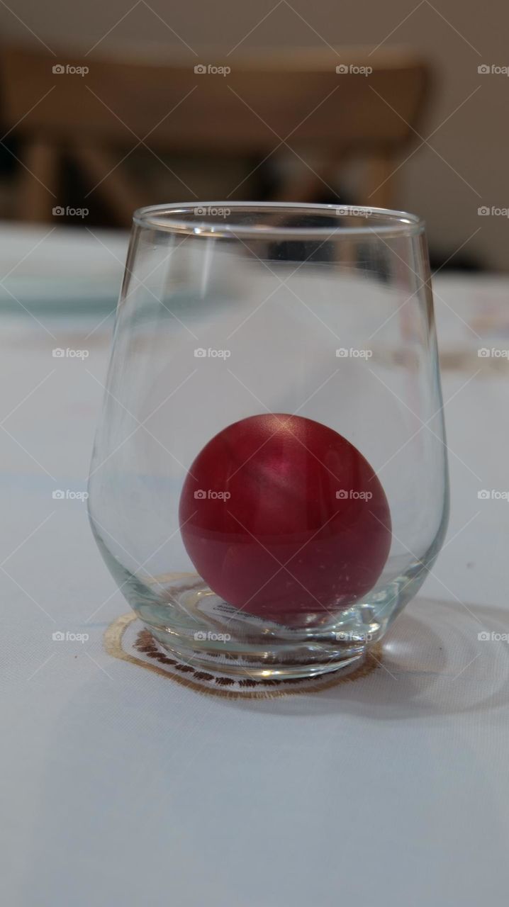 Red egg in a glass