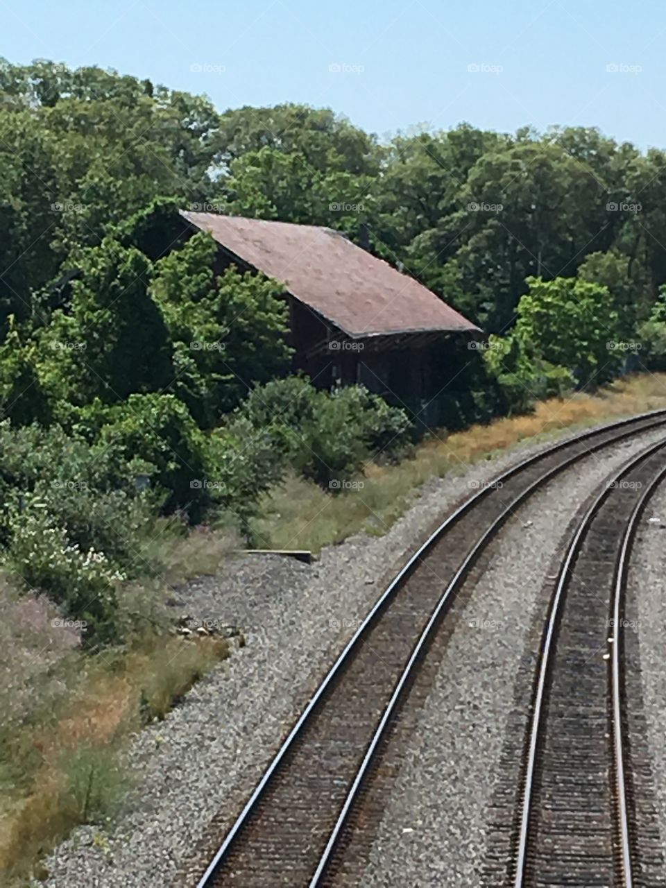 Old original railroad passénger station. Not used in years, overgrown!