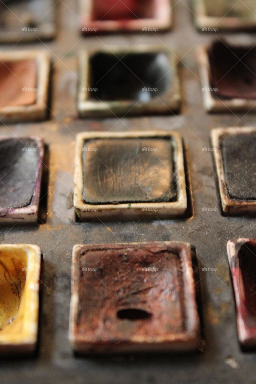 Vintage paint palette very well used to create beautiful paintings, very muted in color tone