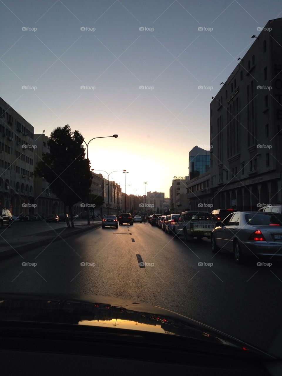 street car sunset buildings by a.bilbaisi