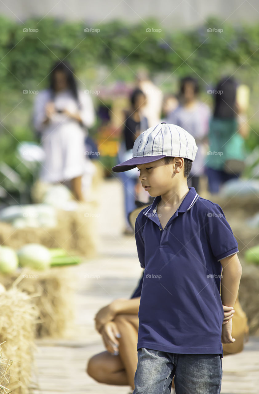 Portrait of Asean boy smiling happily in the park.