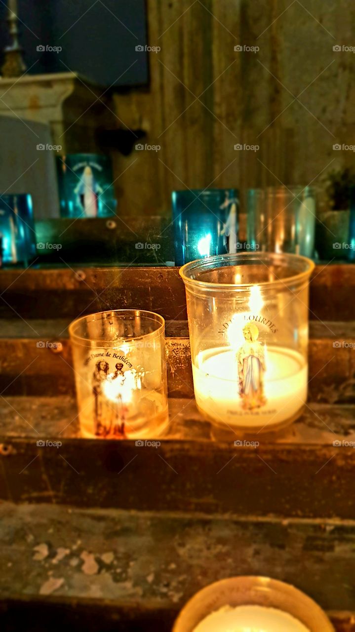 candle in an old church in France