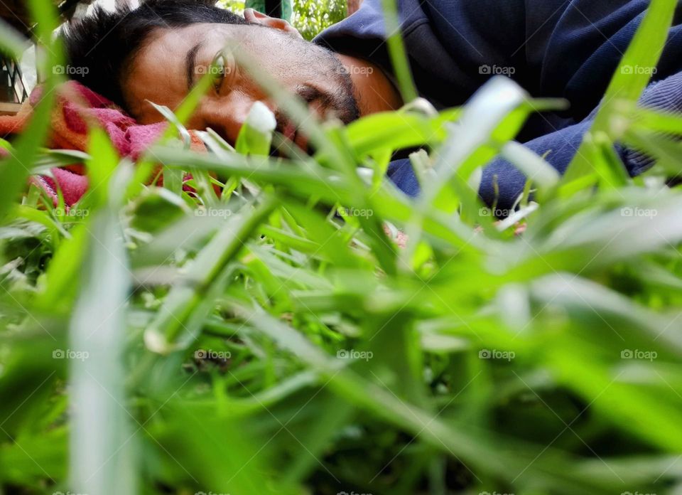 Portrait of self in field of grass