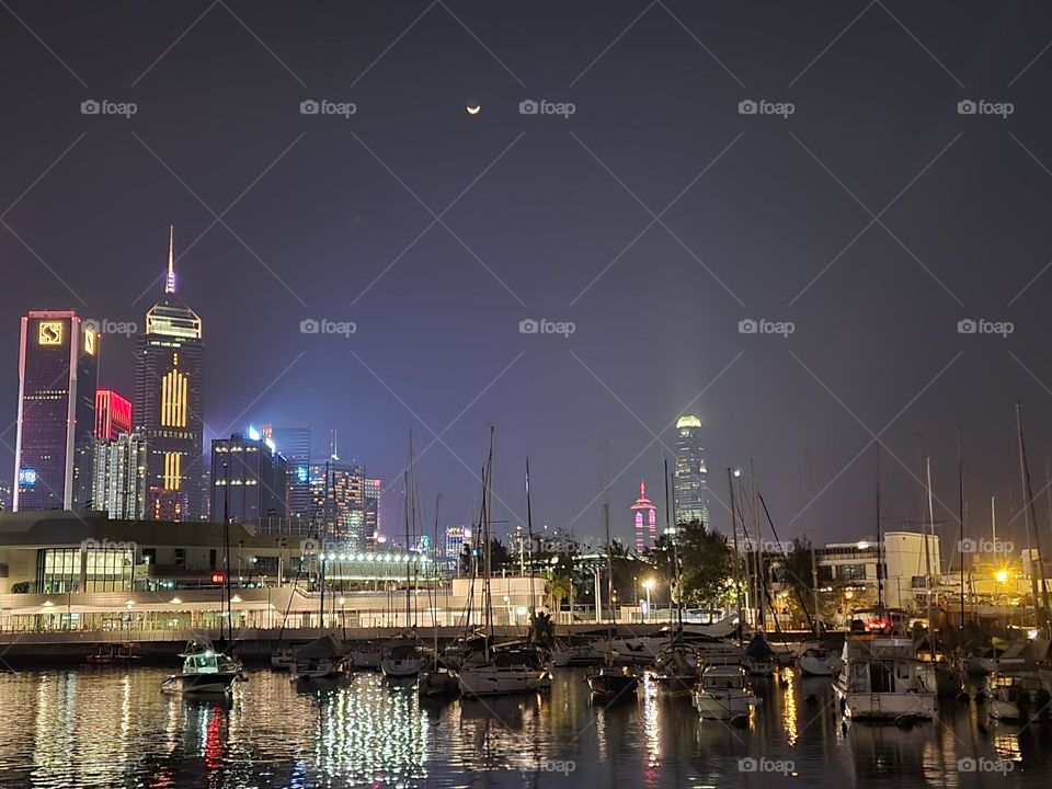 Nightwalk under the moon at Victoria Harbour Hong Kong