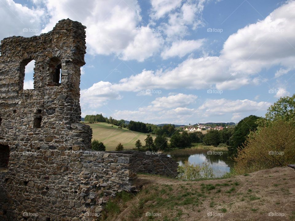 Borotin Castle ruins and blue sky with clouds in Borotin, South Bohemia, Czech Republic.