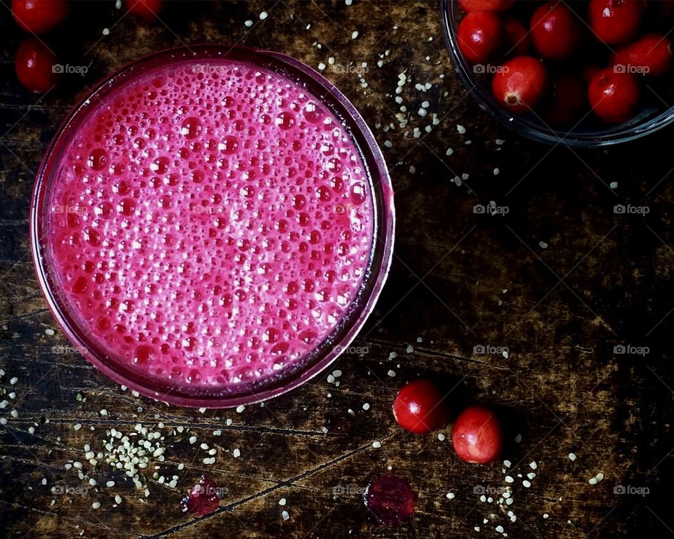 Cranberry Smoothie in glass with bubbles