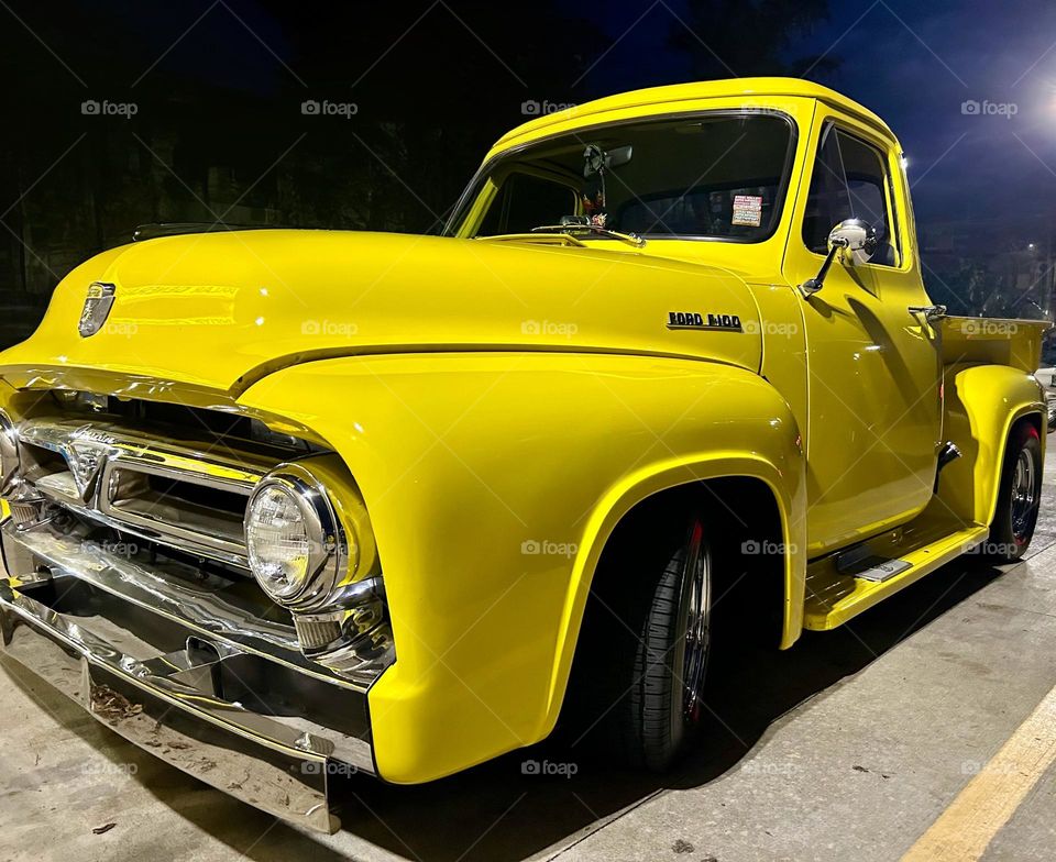 Old Ford pickup truck restored and painted bright yellow 